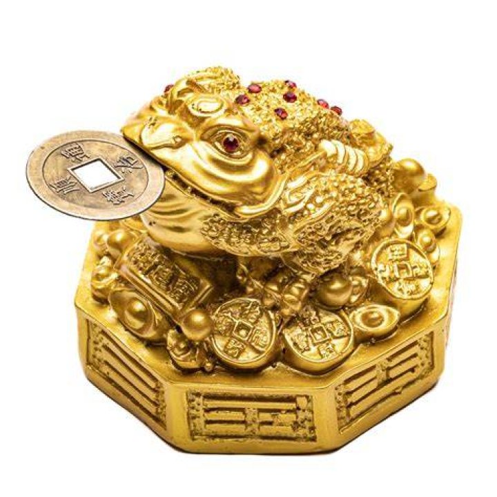 A sculpture of a three-legged one is considered lucky in feng shui Crossword Clue