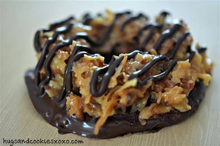 Cookie topped with toasted coconut, caramel and chocolate Crossword Clue