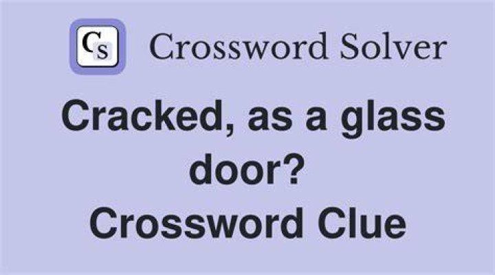 Cracked open, as a door Crossword Clue
