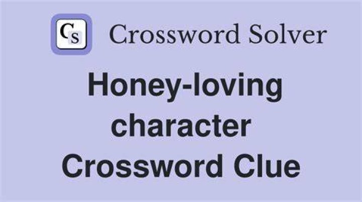 Honey-loving bear Crossword Clue