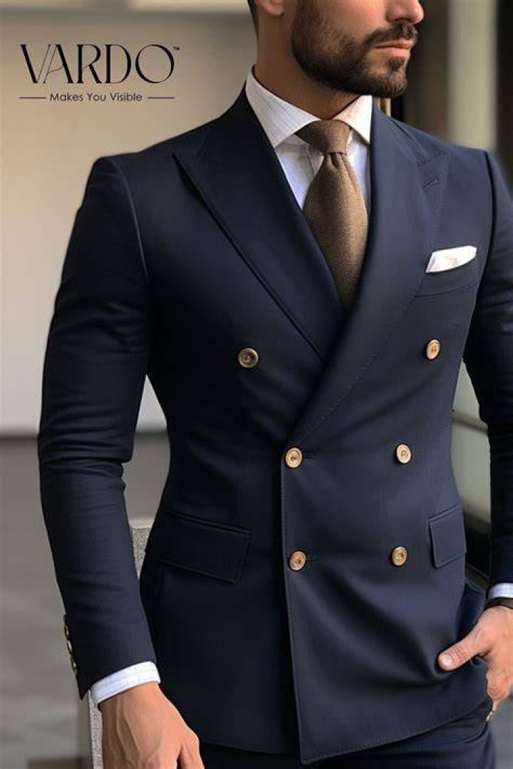 Like men’s double-breasted suits, e.g. Crossword Clue