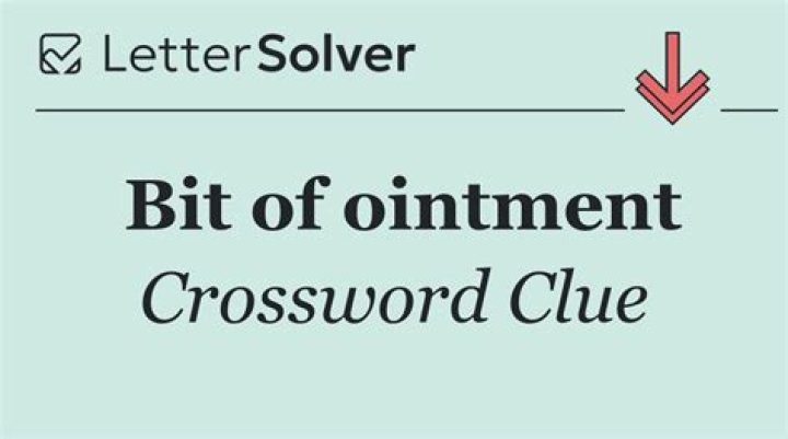 Little bit, as of ointment Crossword Clue