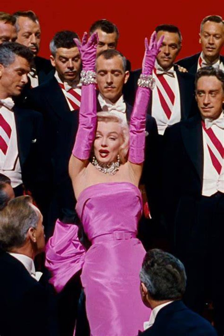 Marilyn Monroe wore a fuchsia one while singing “Diamonds Are a Girl’s Best Friend” Crossword Clue